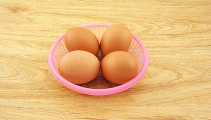 Eggs on pink basket