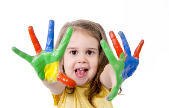 happy little kid with hands painted in colors isolated