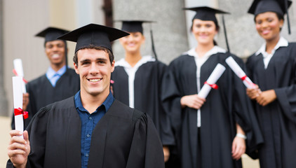 male university graduate holding diploma