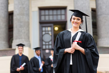 pretty female graduate at college graduation