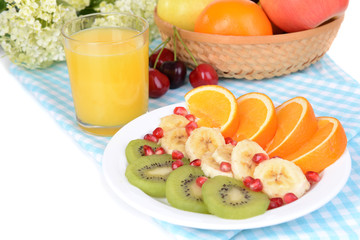 Sweet fresh fruits on plate on table close-up