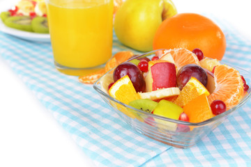 Sweet fresh fruits in bowl on table close-up