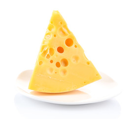 Piece of cheese on plate, isolated on white