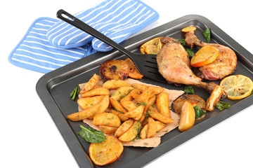 Homemade roasted chicken drumsticks with fried potatoes and