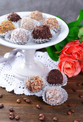 Set of chocolate candies on table on grey background