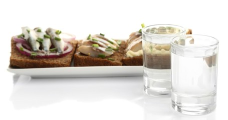 Composition with two glasses  of vodka, and  sandwiches wit