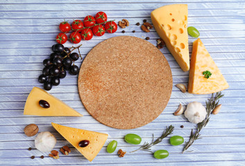 Different Italian cheese on wooden table