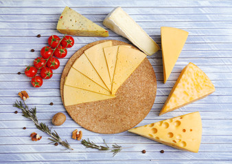 Different Italian cheese on wooden table