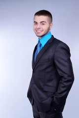 Business man on grey background