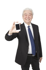 .Senior businessman holding smart phone.