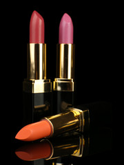 Beautiful lipsticks on black background