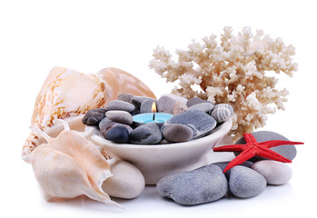 Fototapeta na wymiar Composition with spa stones, candle, coral and star fish,
