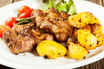 Grilled steaks and baked potatoes