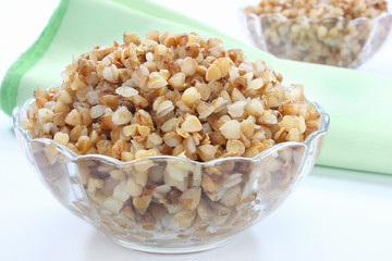 Cooked buckwheat in the glass bowl