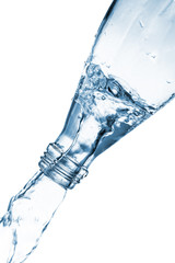 Glass bottle pouring water isolated on white