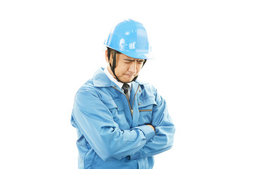 疲れた表情の作業員
