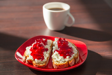 Sandwiches with cottage cheese and cranberry jam fot breakfast 