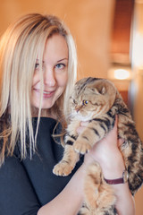 Beautiful blond woman with a cat