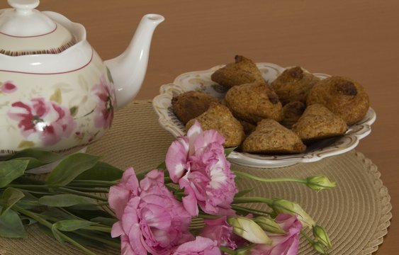 Still life with Teapot and flowers on the table