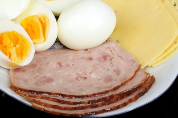 half boiled eggs with ham and cheese