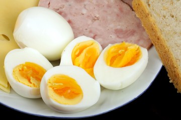 half boiled eggs with ham and cheese