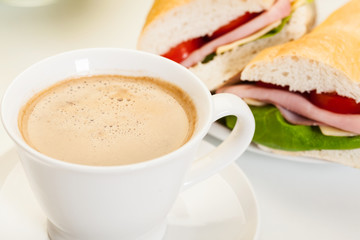 Close-up of coffee with panini sandwich