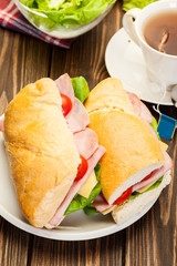 Panini sandwich with ham, cheese and tomato