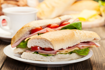 Panini sandwich with ham, cheese and tomato