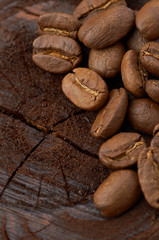Coffee beans on wood background