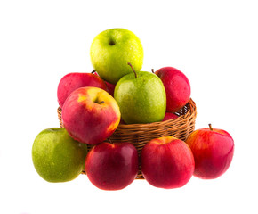 Fresh red and green apples in a wooden basket