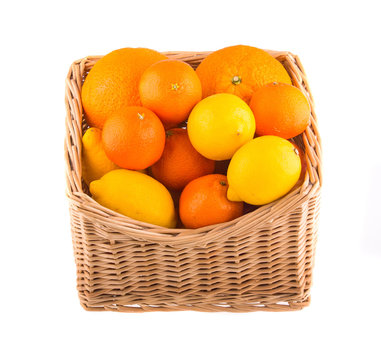 Oranges and lemons in a wooden basket