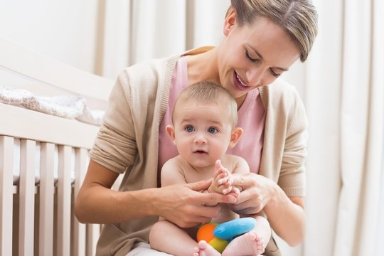 Mother playing with baby