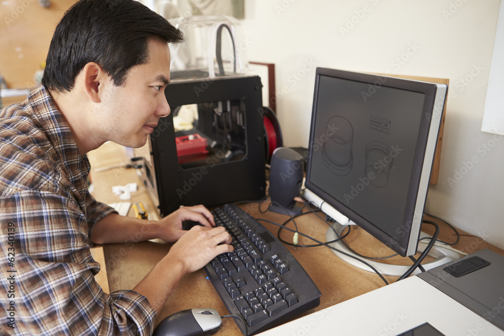 Wall mural male architect using 3d printer in office