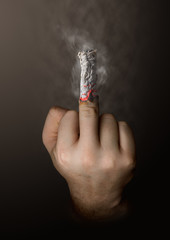 stop smoking concept. cigarette like a middle finger - 62340352