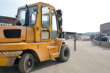 Forklift truck on factory road