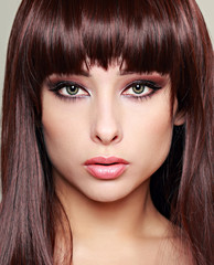 Perfect makeup woman face with green eyes. Closeup