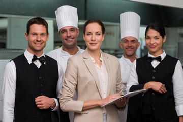 Restaurant team posing together smiling at camera
