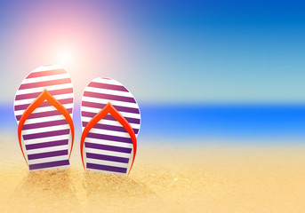 summer flip flops on the beach