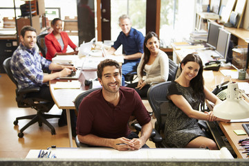 Portrait Of Office Staff At Table In Architect's Office
