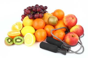 Fitness equipment with fruits on the white background