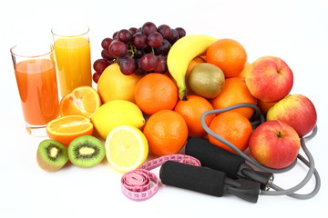 Fototapeta na wymiar Fitness equipment with fruits on the white background