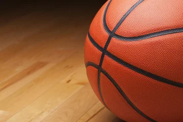 Tuinposter Basketball shot close up on hardwood gym floor © Daniel Thornberg