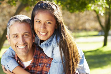 Portrait Of Father And Daughter In Countryside