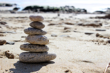 Fototapeta na wymiar zen balance stone on the beach paradise