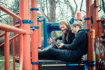 young modern stylish couple using tablet