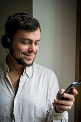 young stylish man lifestyle listening to music