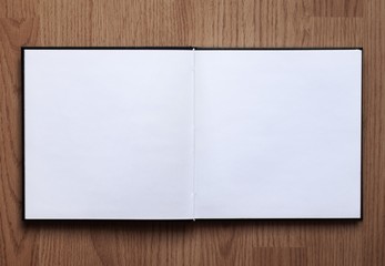 Blank notebook opened on wood background 6