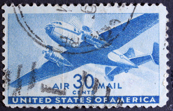United States Airmail postage stamp shows image of a twin-engine