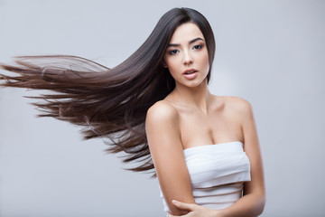 Beautiful Brunette Girl with Healthy Long Hair