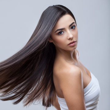 Beautiful Brunette Girl with Healthy Long Hair